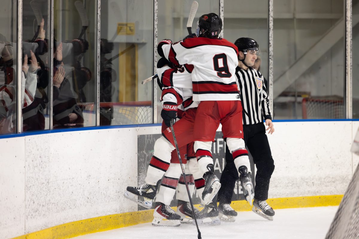 Kondub teammates congratulate him on his 200th point.